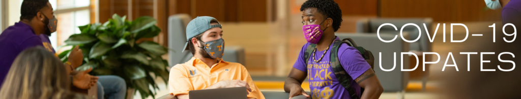 4 students in a commons area with masks on